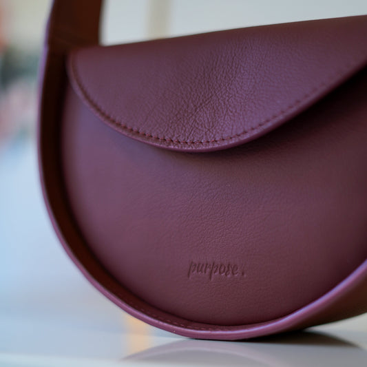 burgundy pixie handtas purpose.