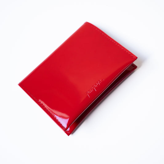 pasporthoes in leer rood